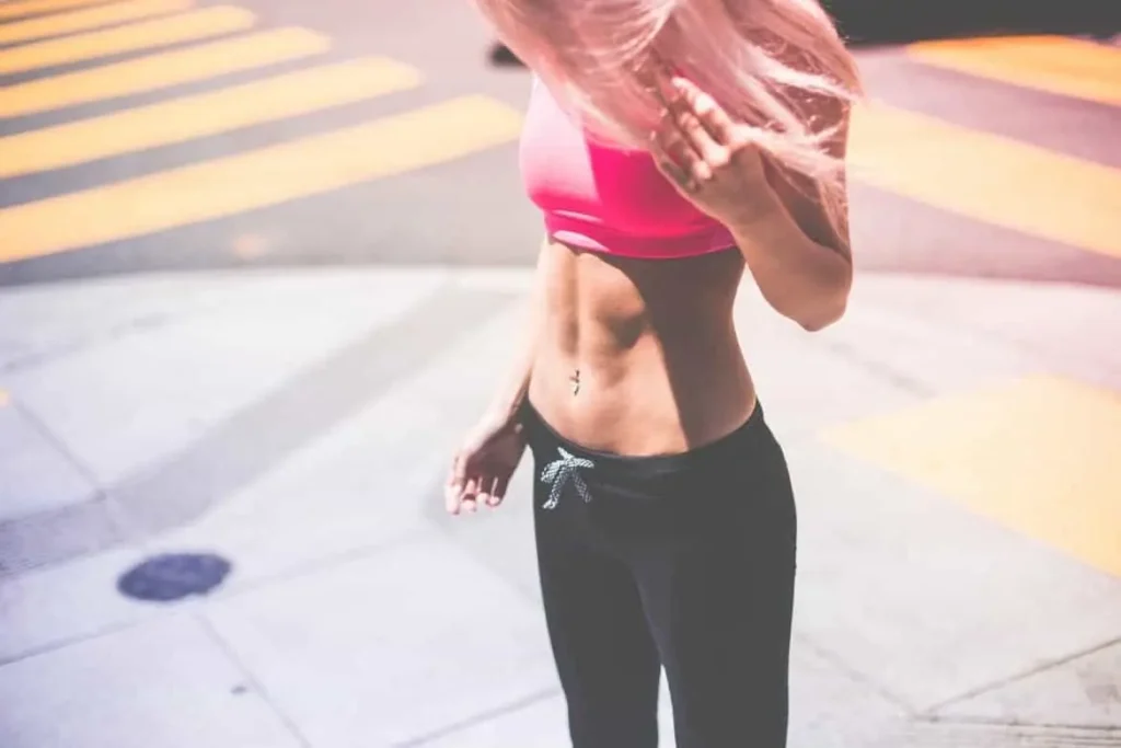 Woman with toned stomach after LA-EMS Body Sculpting Treatment East Kilbride