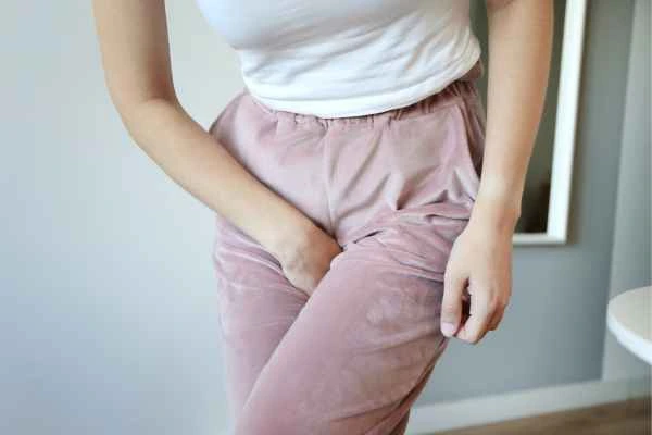 woman running for the toilet because of urinary incontinence East Kilbride